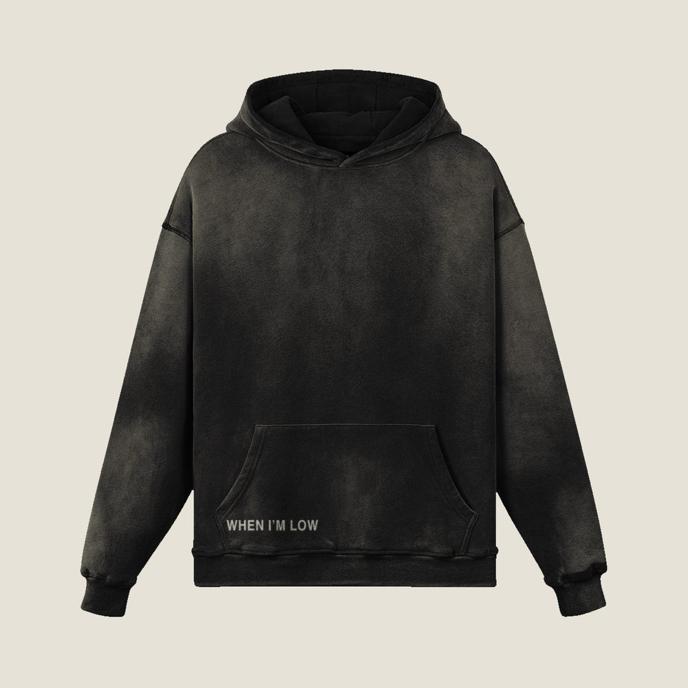 When I&rsquo;m Low heavyweight hoodie in Smoky Black, front &mdash; WHEN I AM LOW at the hem