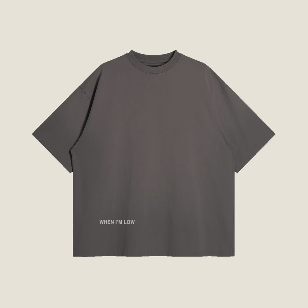 When I&rsquo;m Low tee in Smoky Gray, front &mdash; WHEN I AM LOW at the hem